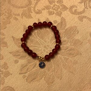 Hand Crafted Deep Red Beaded Bracelet with Gold Details